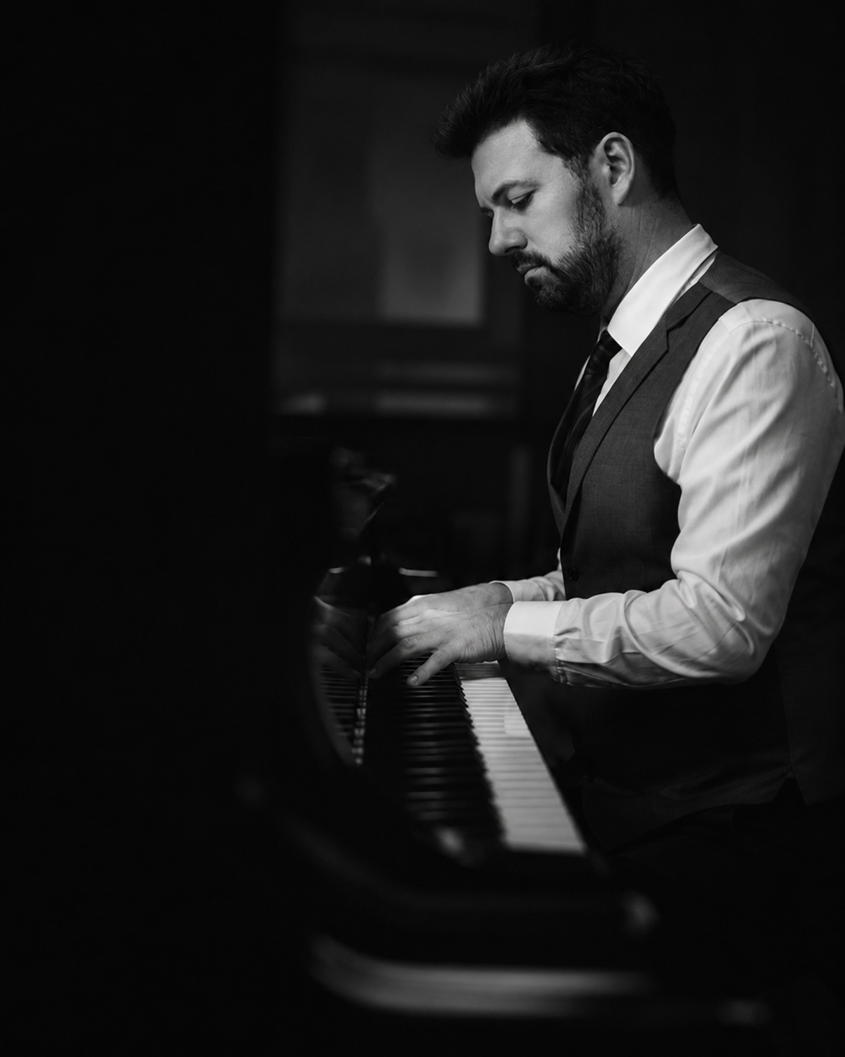 Adam Gravelle performing at the piano